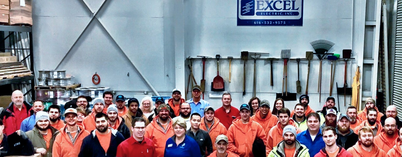 Excel staff standing in the warehouse